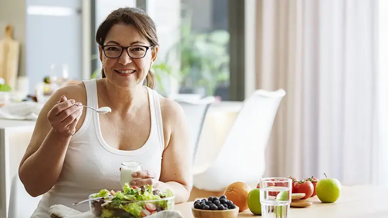 Lady having a health meal full with a balance of probiotics and prebiotics